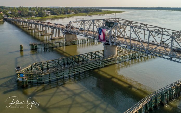 Beaufort's Woods Memorial Bridge hosts enormous flag for holiday