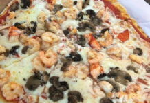 This waterfront spot has the only seafood pizza you’ll find in Beaufort SC This waterfront spot has the only seafood pizza you'll find in Beaufort SC