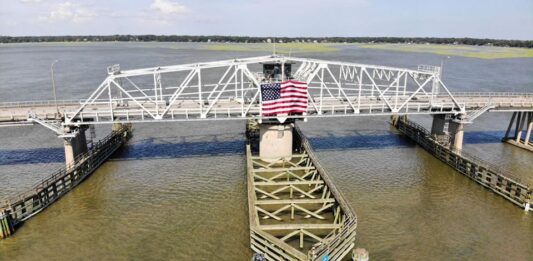 Beaufortβs Woods Memorial Bridge hosts flag for 4th of July holiday Beaufortβs Woods Memorial Bridge hosts flag for 4th of July holiday
